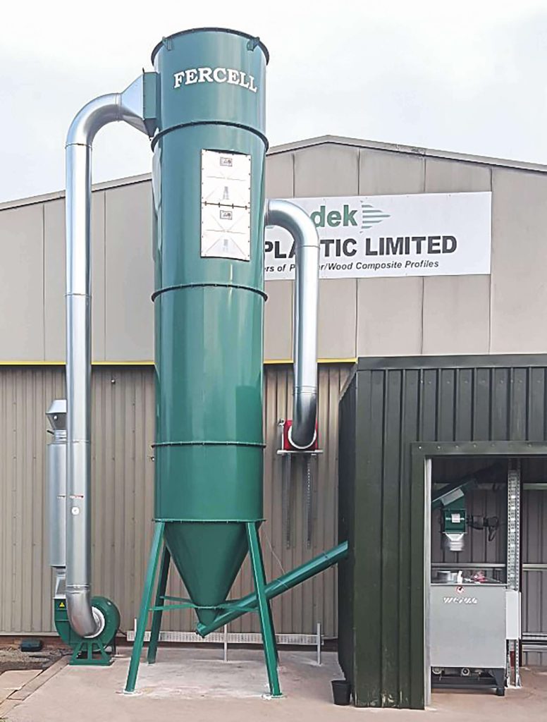 Absaug- und Filteranlage neben einer WEIMA C 140 Brikettierpresse