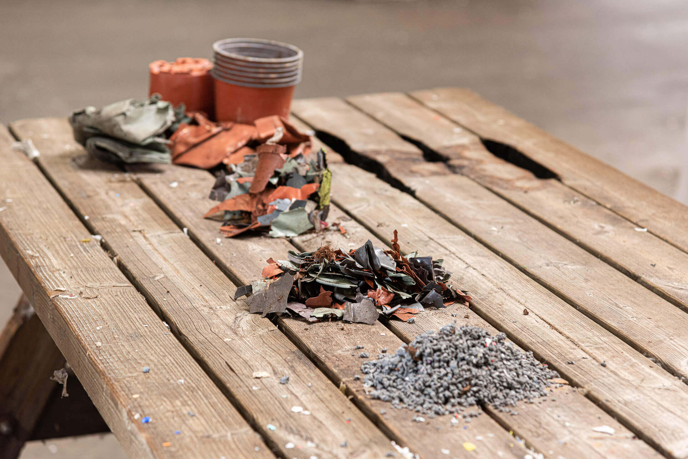 Different material states of flower pot recycling process from raw material to granules.