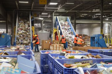 Books are transported by conveyor belts to two WEIMA shredders.