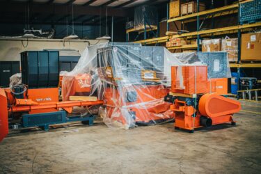 WEIMA machinery is staged in a warehouse and is ready to ship.