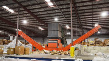 WEIMA WLK 18 shredder discharges shredded paper on two conveyor belts