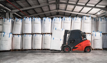 Full big bags with forklift for transporation