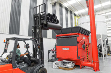 weima shredder filled by forklift with hdpe pipe offcuts