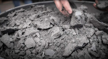 pieces of dried drilling mud, sludge and slurry