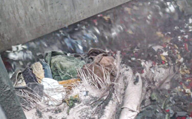 Textiles are shredded in a WEIMA shredder; a view inside the shredder's cutting chamber